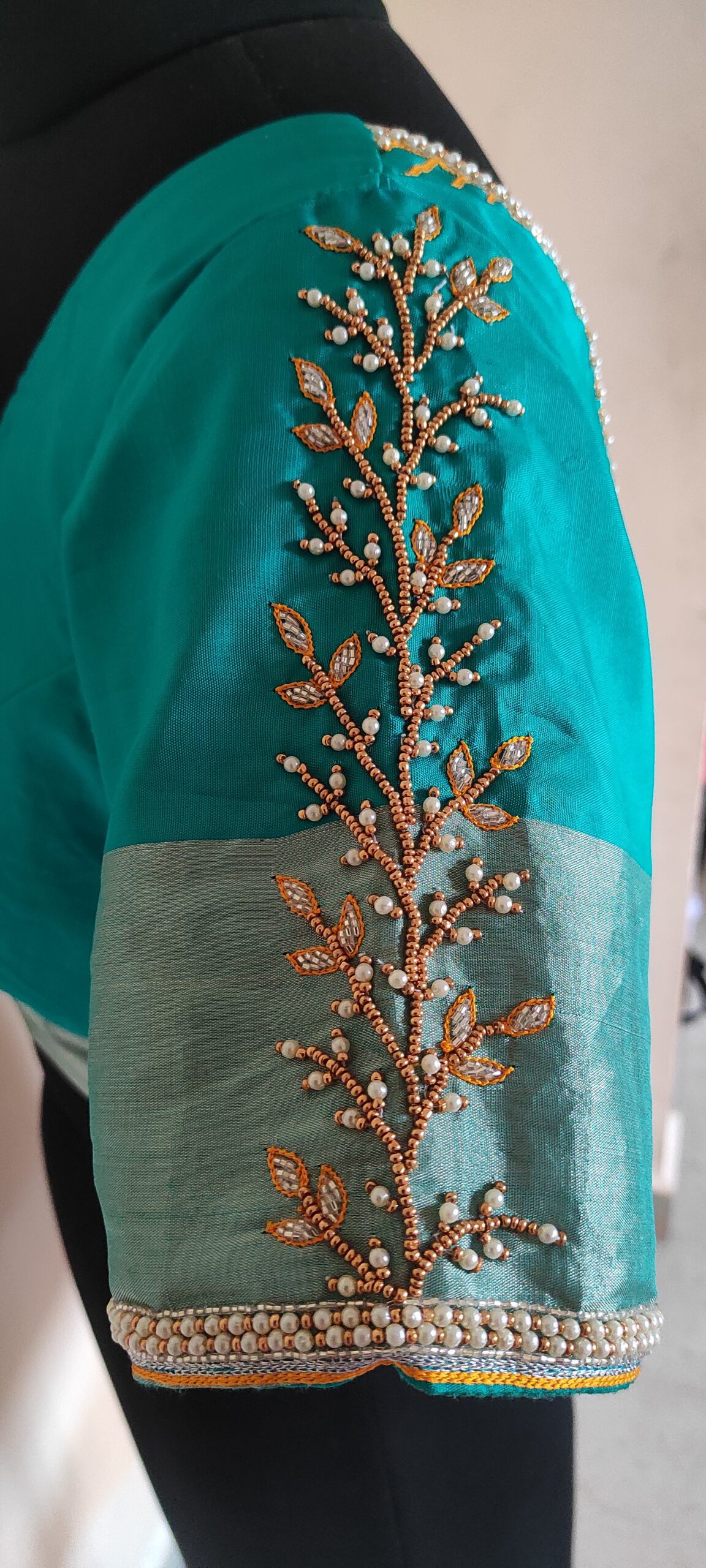 Elevating Bridal Blouses: Aari embroidery on sleeves with Elegance